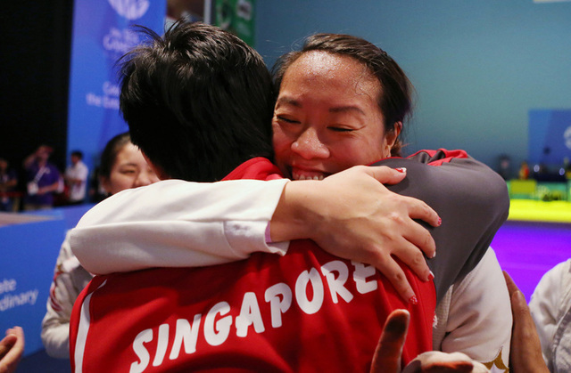 28th SEA Games Singapore 2015 - OCBC Arena Hall 2, Singapore - 6/6/15  Fencing - Women's Team Foil Final - Singapore v Vietnam - Singapore's Wang Wenying celebrates with after winning the gold medal SEAGAMES28 TEAMSINGAPORE Mandatory Credit: Singapore SEA Games Organising Committee / Action Images via Reuters