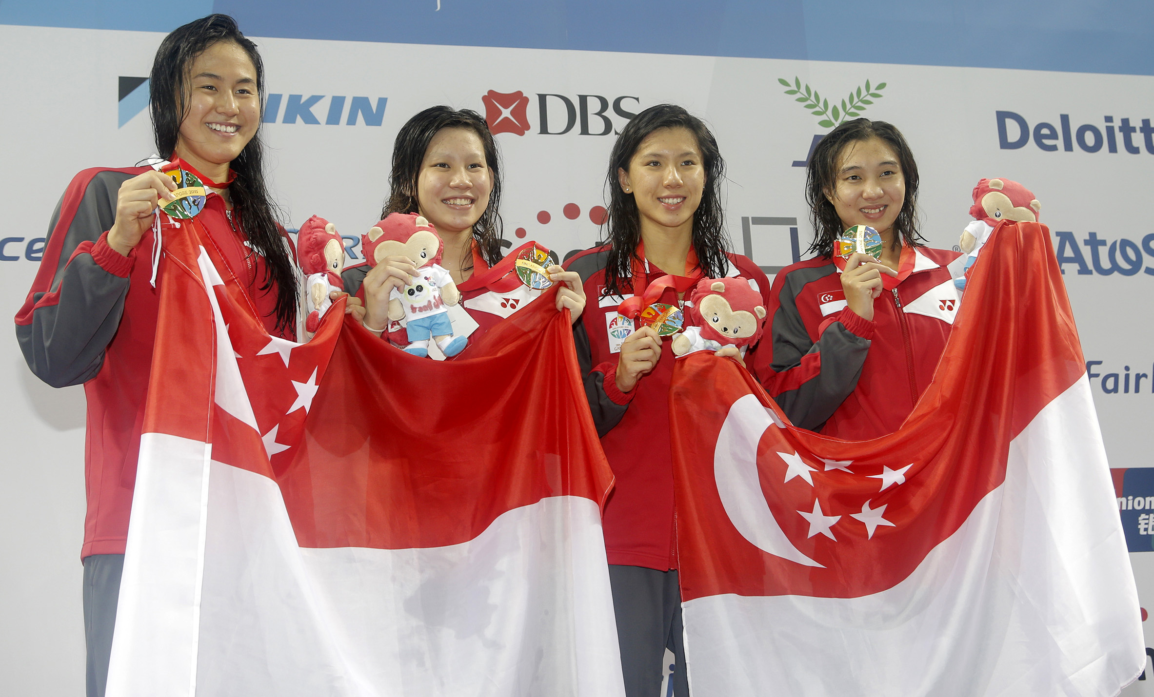28th SEA Games Singapore 2015 - OCBC Aquatic Centre,  Singapore - 6/6/15  Swimming - Women's 4x100m Freestyle Relay - Final -  The Singapore team celebrates winning SEAGAMES28 TEAMSINGAPORE Mandatory Credit: Singapore SEA Games Organising Committee / Action Images via Reuters