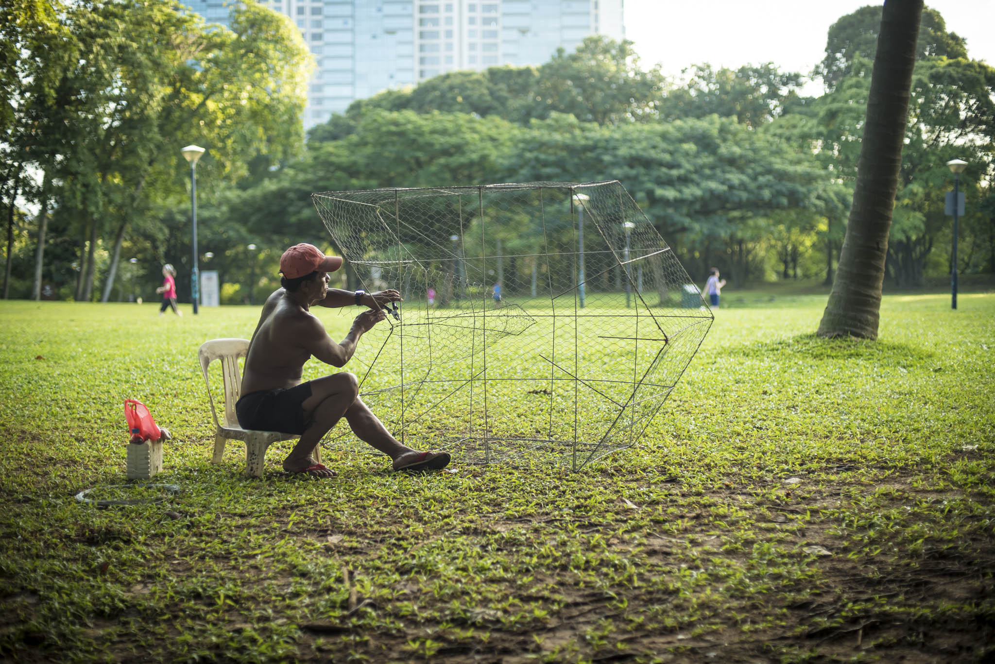 Selasa putting final touches to another fine bubu made with chicken wire mesh and steel rods. Sudong islanders continue to pursue their love for the sea and fishing using their own boats docked at West Coast Park. 2015/01/10. #islandnation