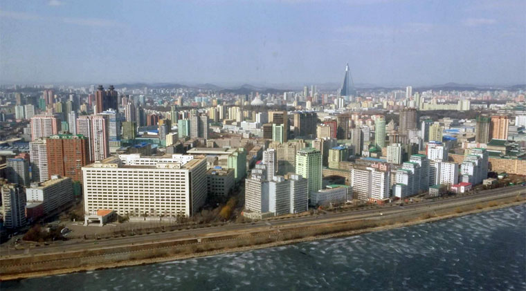 The pyramid-shaped building sticking out is the infamous 105-storey Ryugyong Hotel that hasn't finished construction since 1987.