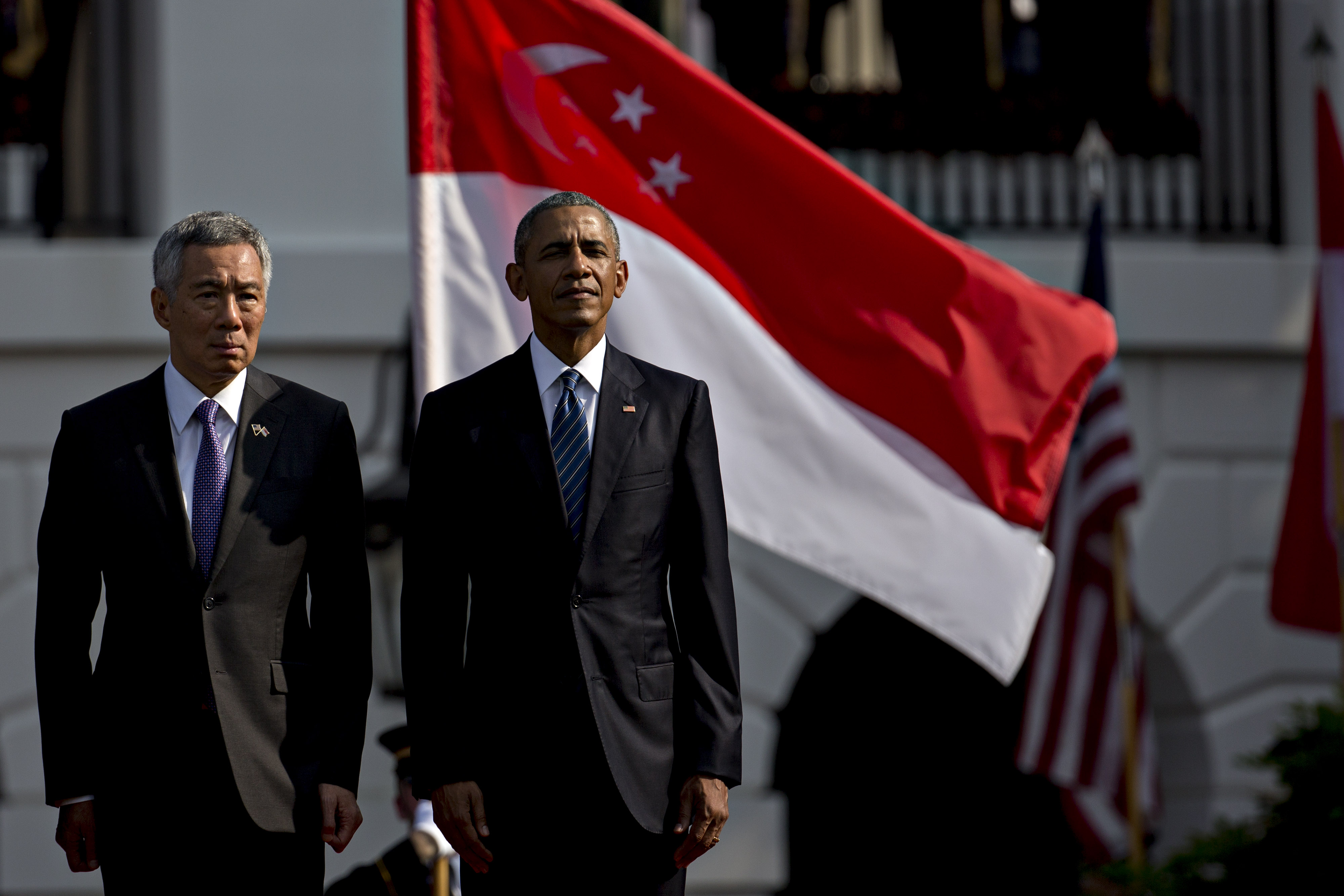 U.S. President Barack Obama, right, and Lee Hsien Loong, Singapore's prime minster, participate in an official arrival ceremony on the South Lawn of the White House in Washington, D.C., U.S., on Tuesday, Aug. 2, 2016. The occasion marks first official visit by a Singapore prime minister since 1985. Photographer: Andrew Harrer/Bloomberg via Getty Images