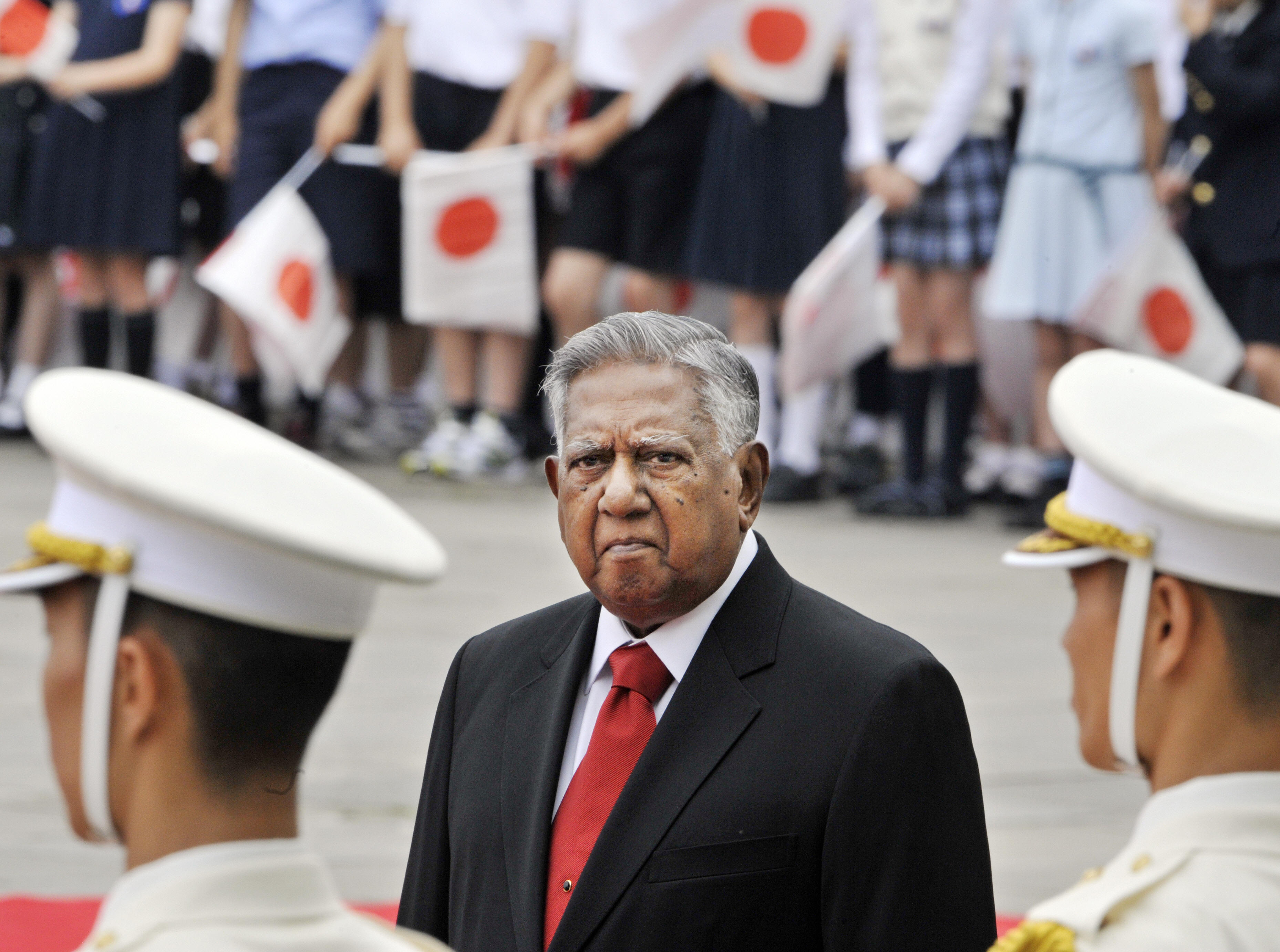 Visiting Singaporean President S.R. Nathan (C) inspects the honor guards during the welcoming ceremony at the Imperial Palace in Tokyo on May 11, 2009. Nathan is now here on a week-long state visit to Japan. AFP PHOTO / POOL/ Yoshikazu TSUNO (Photo credit should read YOSHIKAZU TSUNO/AFP/Getty Images)