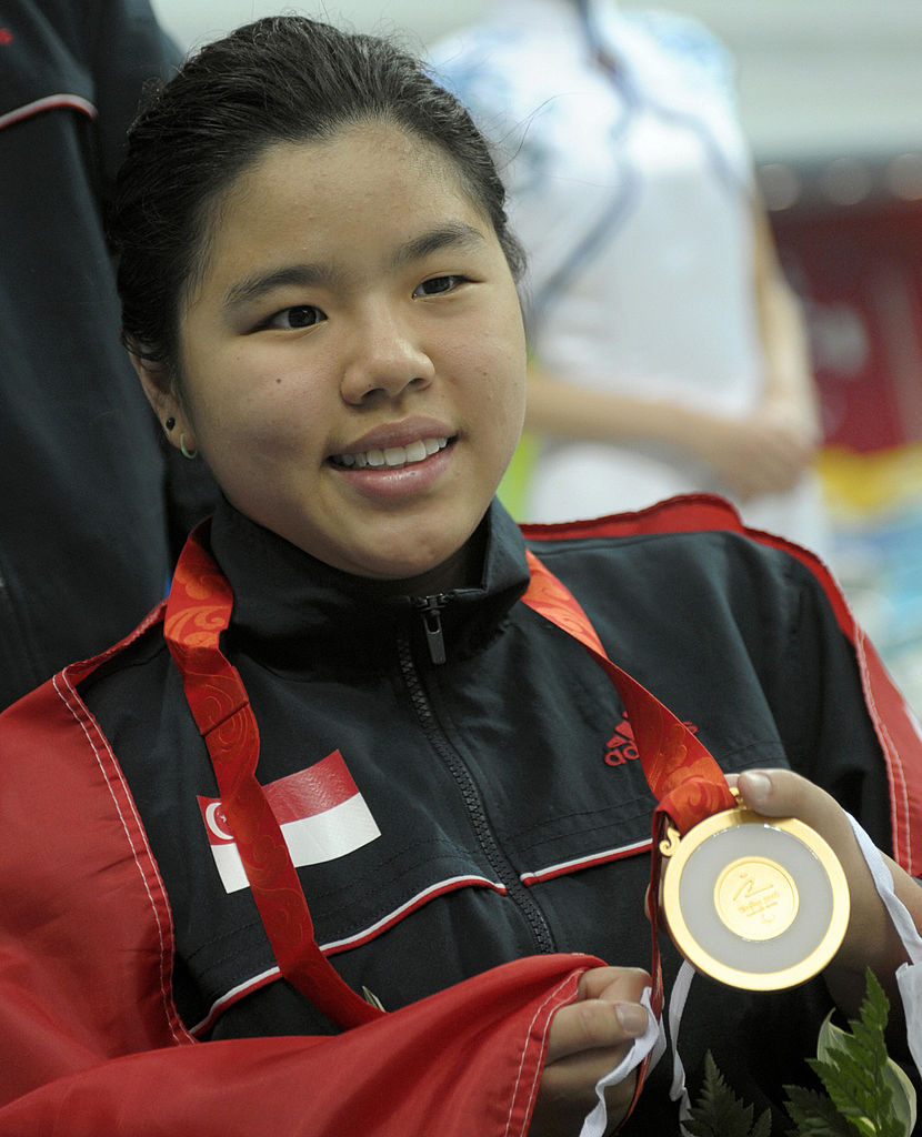 Yip Pin Xiu of Singapore poses with her gold medal at the medal ceremony for the women's 50m backstroke S3 final during the 2008 Beijing Paralympic Games at the National Aquatics Center in Beijing on September 15, 2008. Yip Pin Xiu won the champion. AFP PHOTO/LIU Jin (Photo credit should read LIU JIN/AFP/Getty Images)