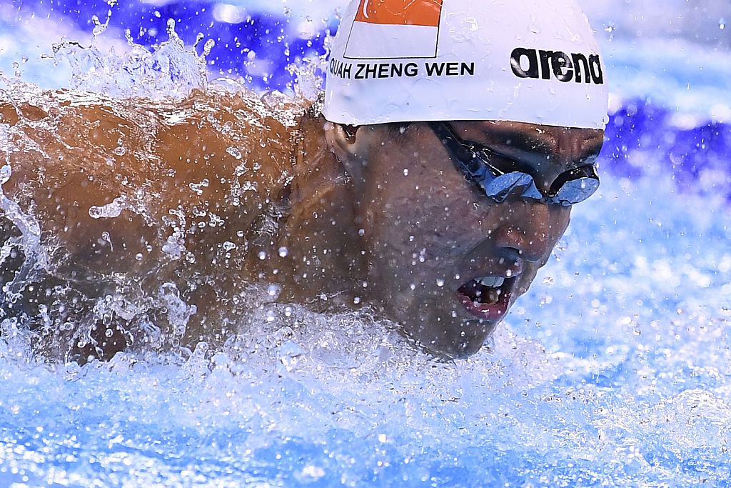 Singapore's Quah Zheng Wen competes in a Men's 100m Butterfly heat during the swimming event at the Rio 2016 Olympic Games at the Olympic Aquatics Stadium in Rio de Janeiro on August 11, 2016. / AFP / GABRIEL BOUYS (Photo credit should read GABRIEL BOUYS/AFP/Getty Images)