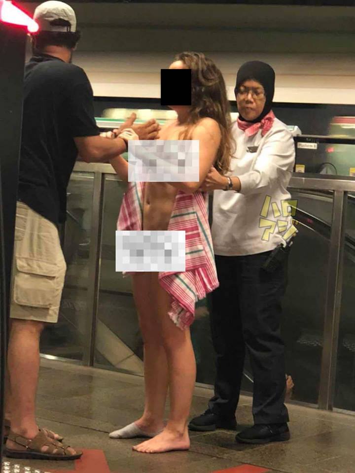 Naked woman, 35, at Pioneer MRT Station arrested - YouTube