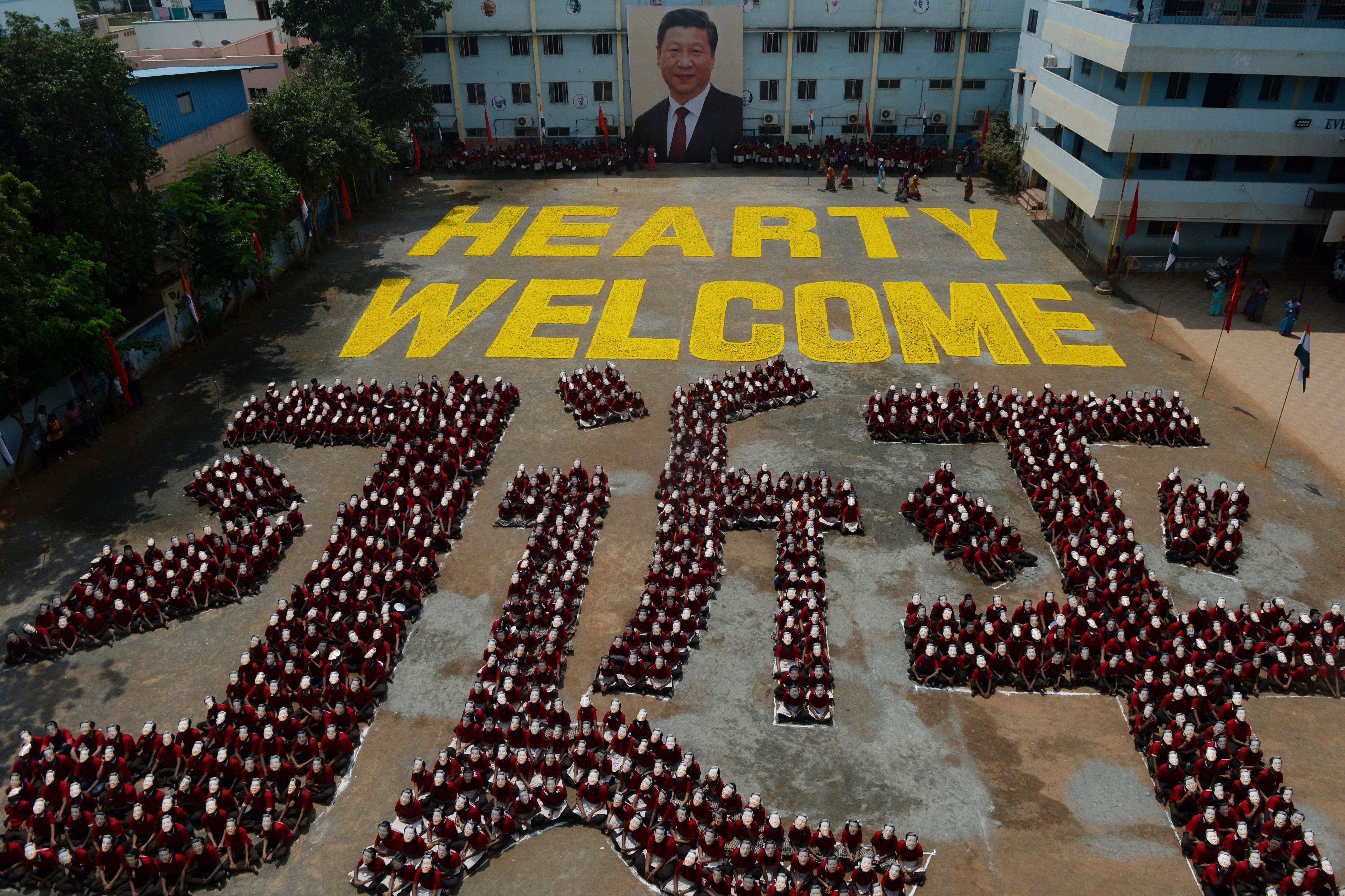 Indian school students form the Chinese character for the name of Chinese President Xi Jinping, in Chennai on October 10, 2019, ahead of a summit with his Indian counterpart Narendra Modi held at the World Heritage Site of Mahabalipuram from October 11 to 13 in Tamil Nadu state.