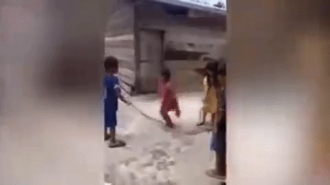 kids using snake as skipping rope