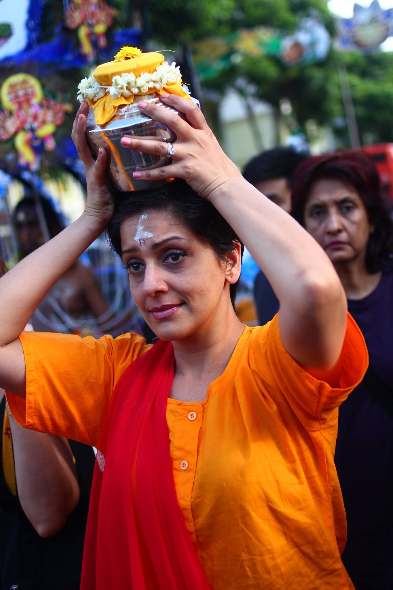 photo of lady carrying milk pot