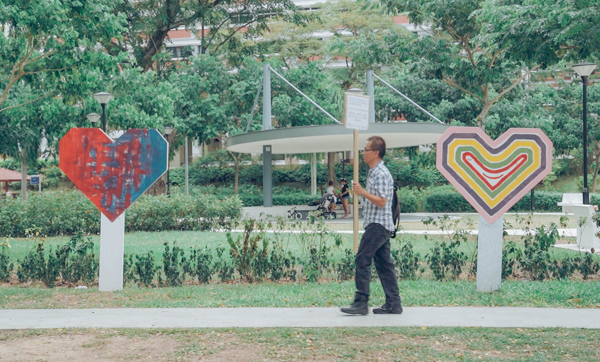 Ong Chin Guan aka Ah Guan walking between 2 hearts