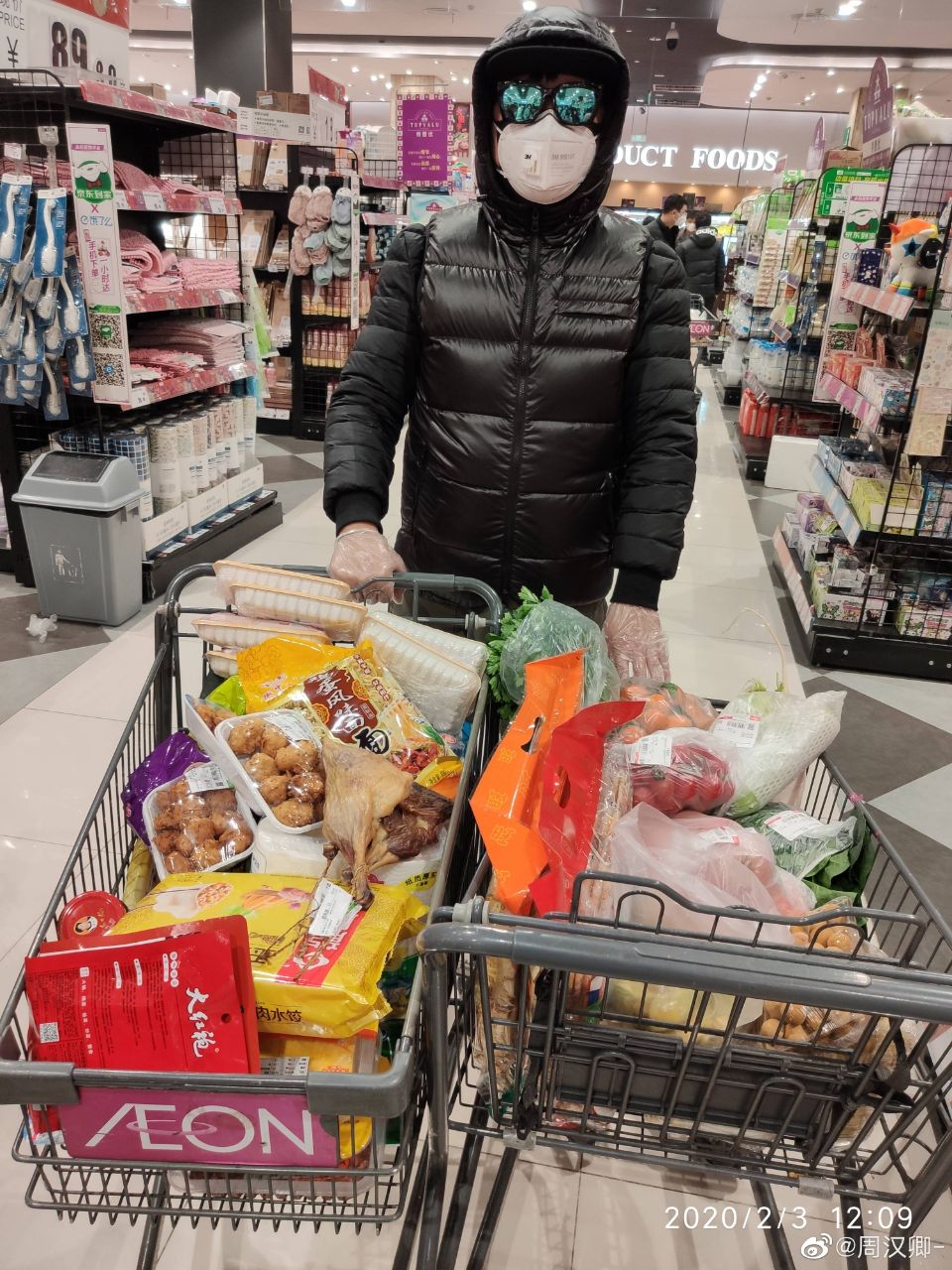 Wuhan man stocking up on food supplies at supermarket during city lockdown