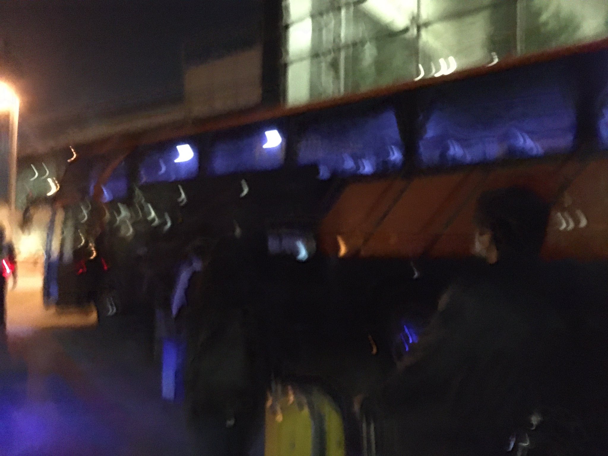 blur photo of people boarding bus for SHN