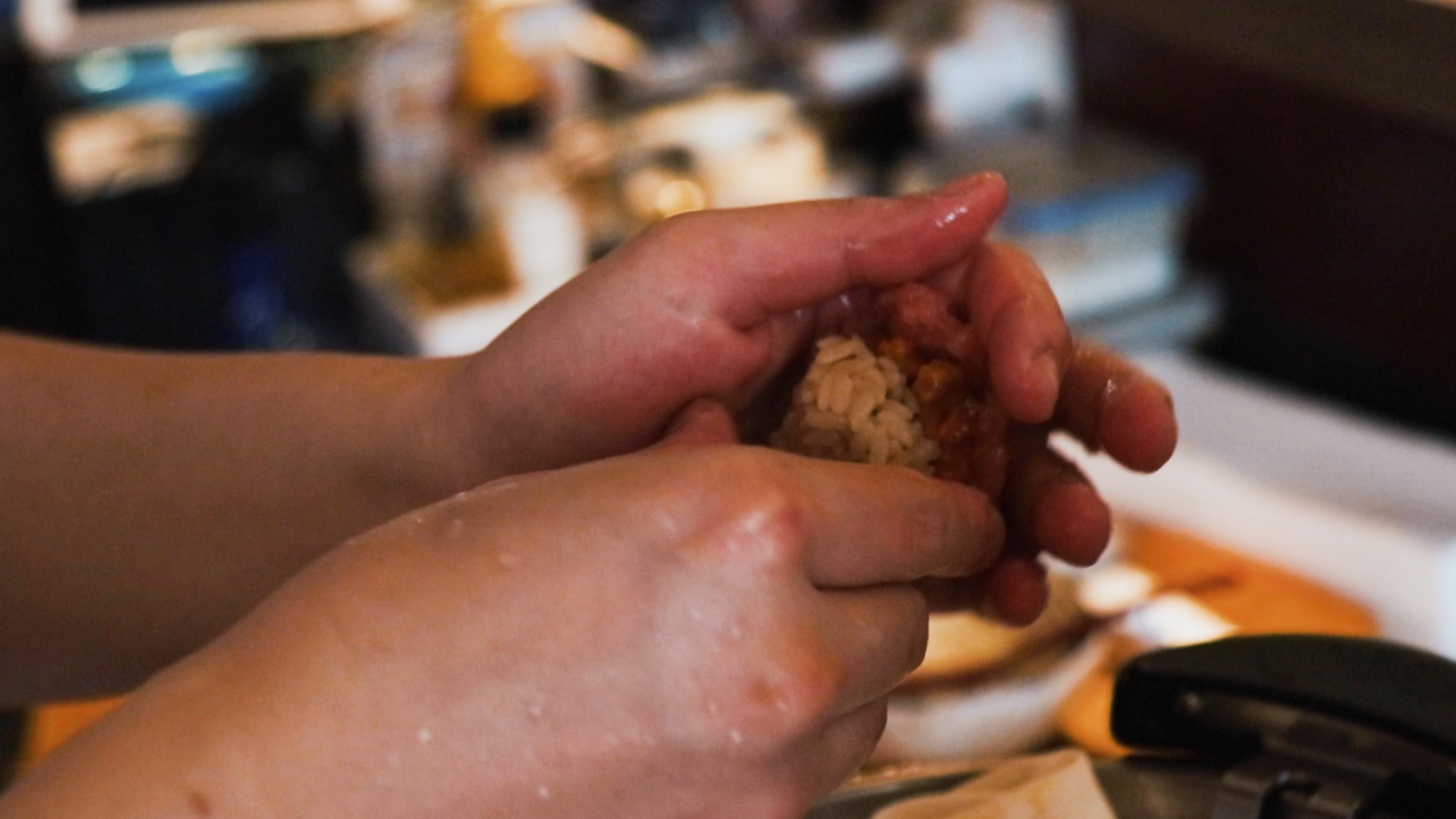 Sushi Chef Aeron Choo shapes rice for sushi