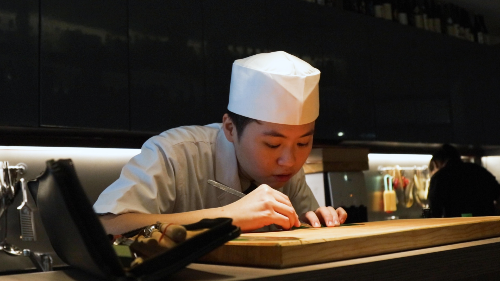Sushi Chef Aeron Choo demonstrates delicate knife work