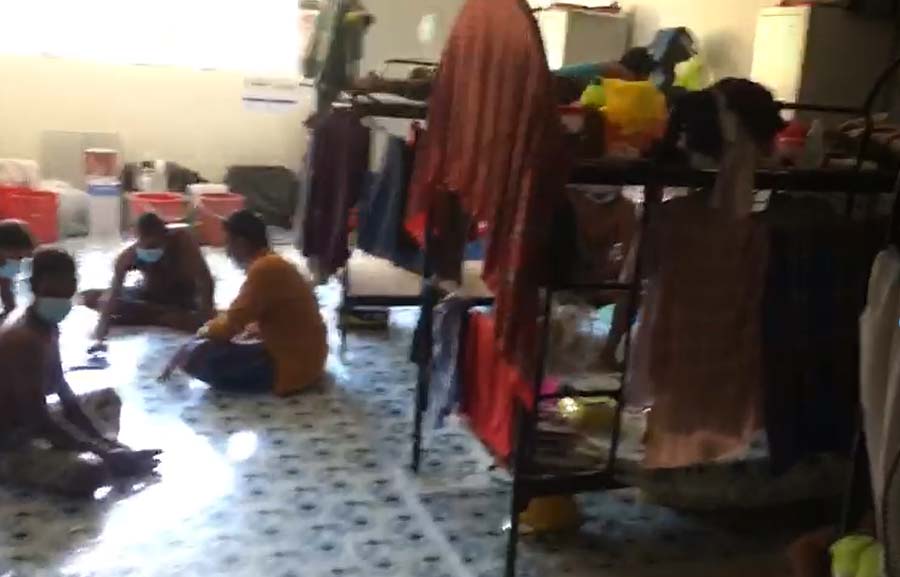 Workers allegedly locked in a dormitory - Photo via TWC2 on Facebook