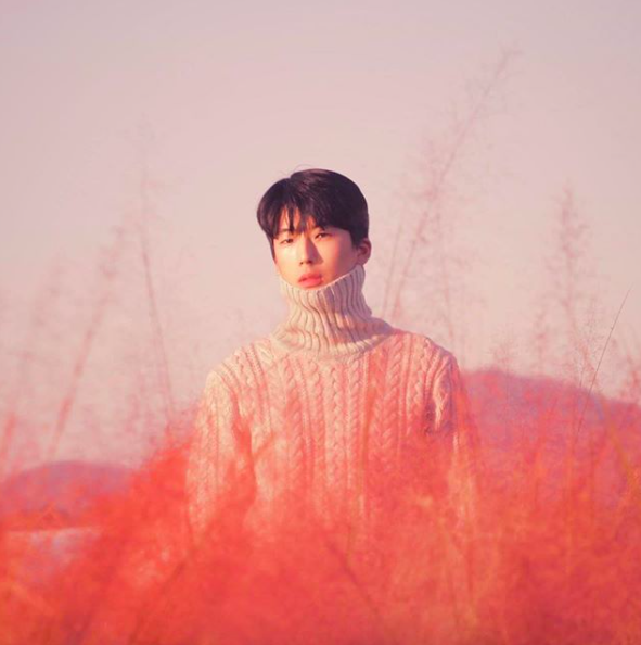 photo of guy standing in nari park tall grass