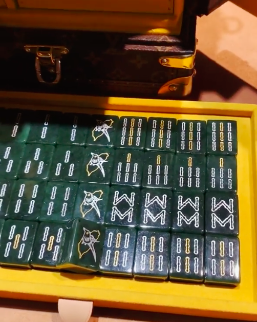 A Louis Vuitton Mahjong Set Height 5 3/4 x width 20 x depth 13 inches.