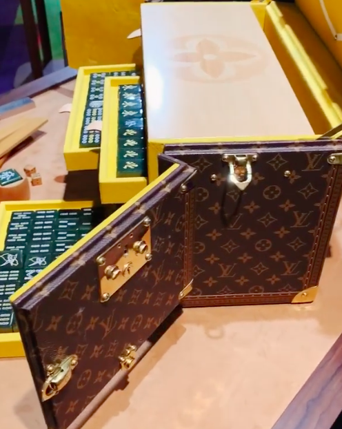 A Louis Vuitton Mahjong Set Height 5 3/4 x width 20 x depth 13 inches.