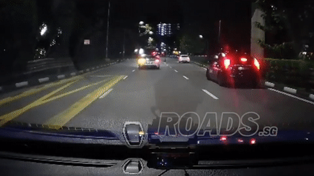 Gif showing cars slowing down to avoid the woman. 