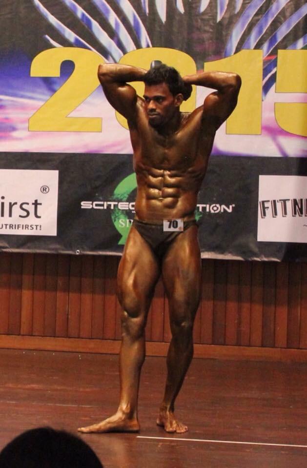 Image of Murugesan at a bodybuilding competition in Singapore