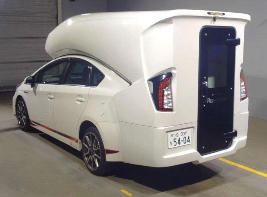 Toyota Prius converted into camper van thing with enough room for 4