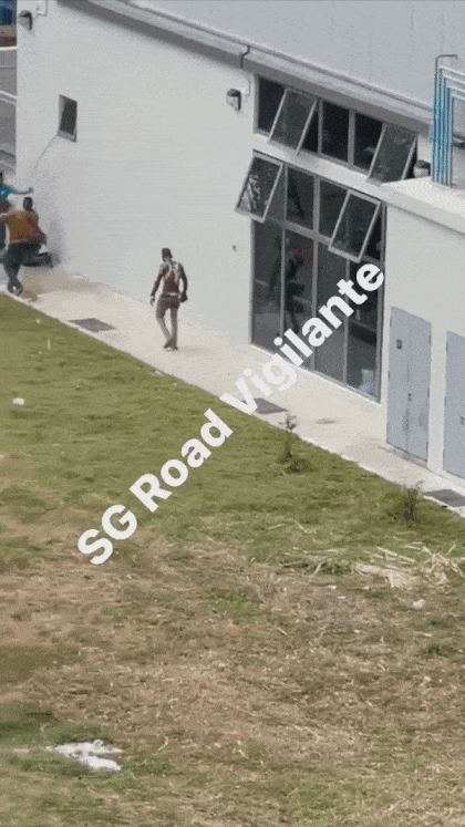 Gif of workers getting hosed down