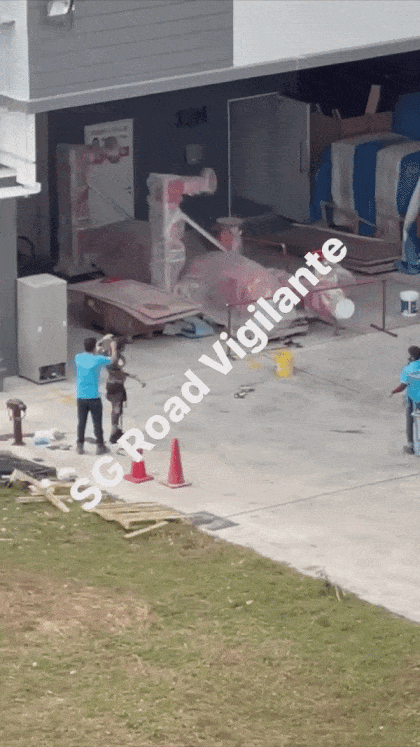 GIF of workers getting strips of torn clothing removed