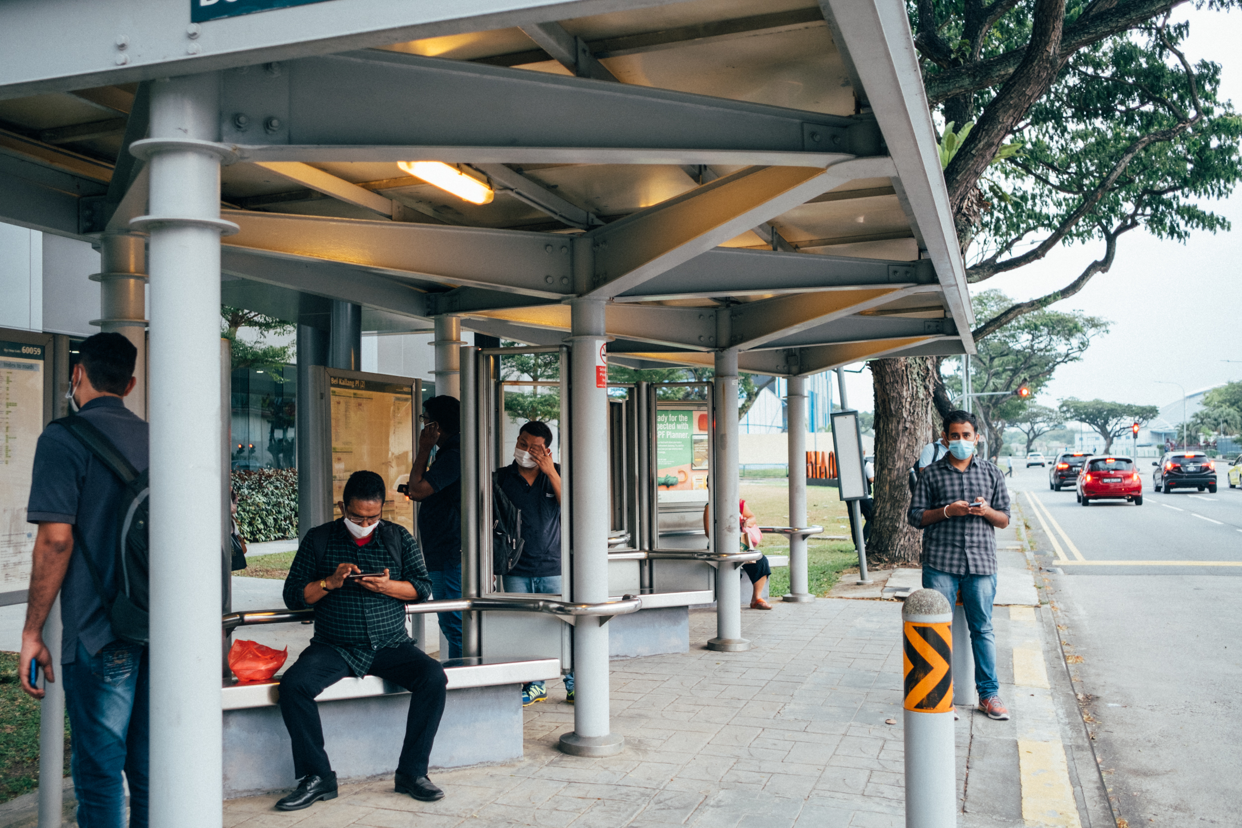 Image of people waiting at a bus stop