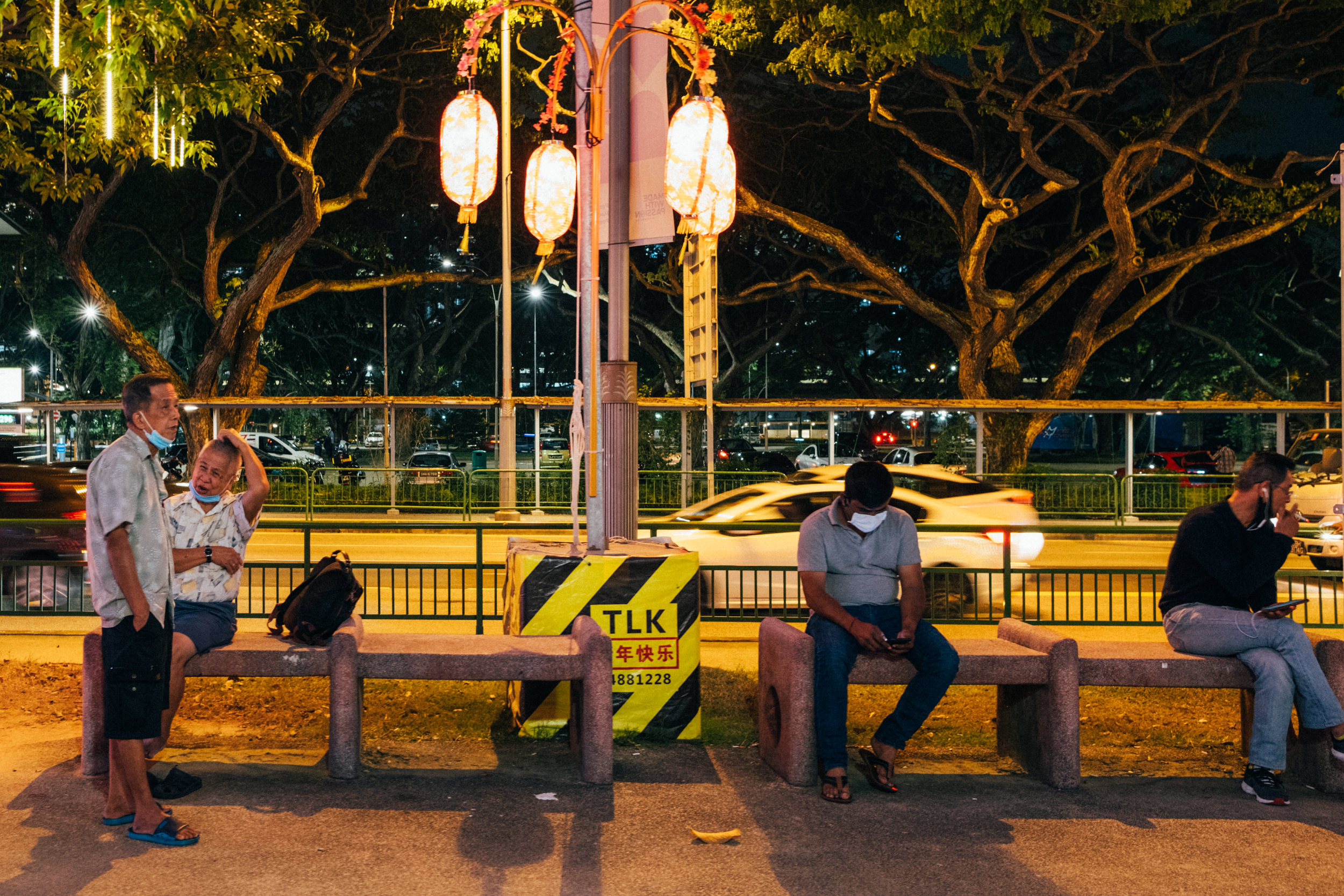 Image of people sitting around in Paya Lebar