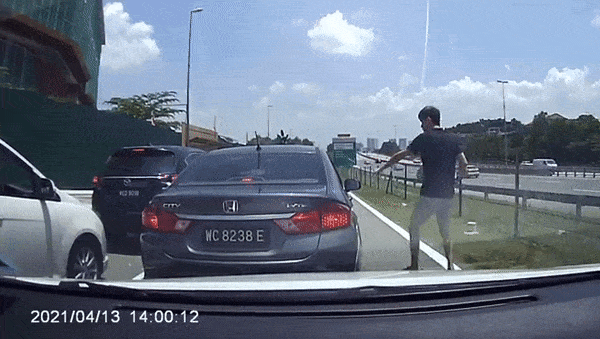 Gif of the driver being dragged out of the car
