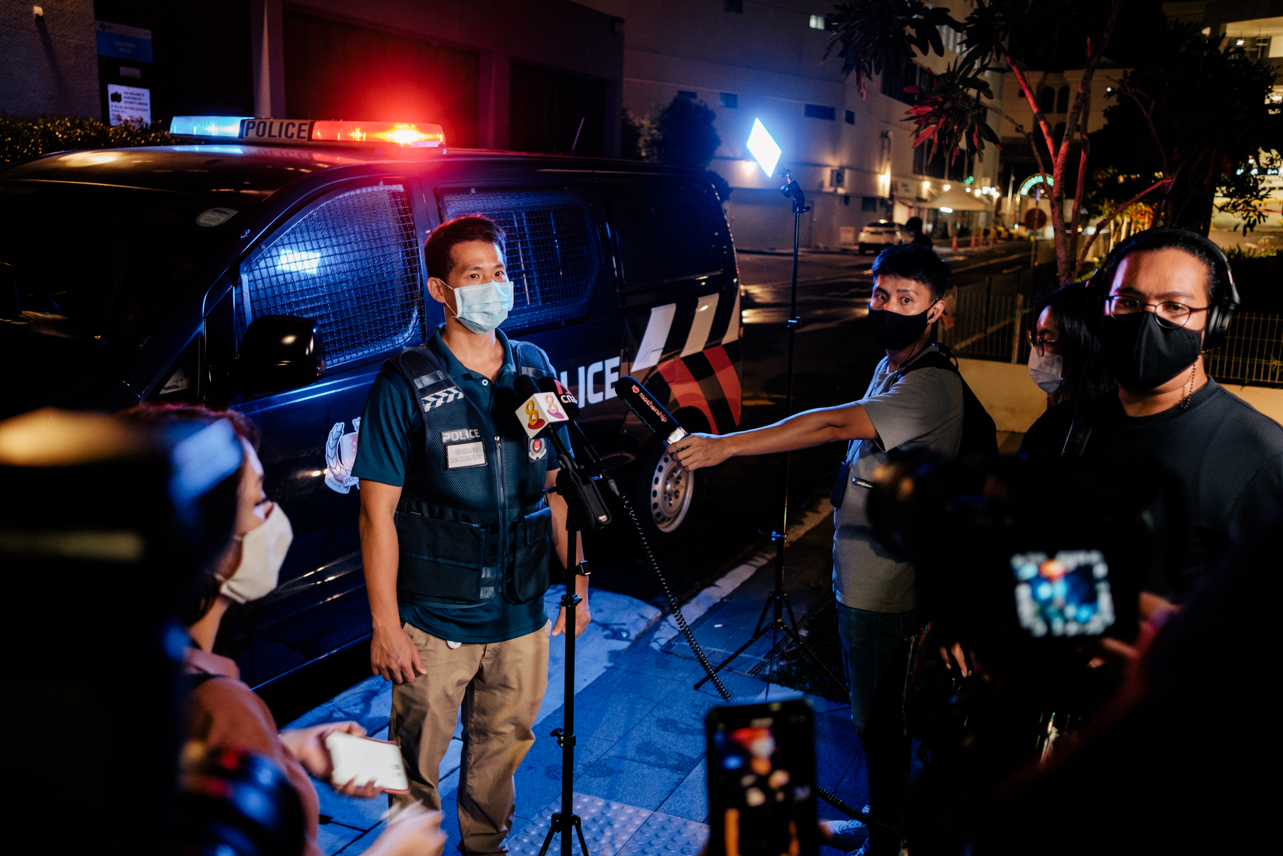 Image of Assistant Commissioner of Police Gregory Tan addressing the media