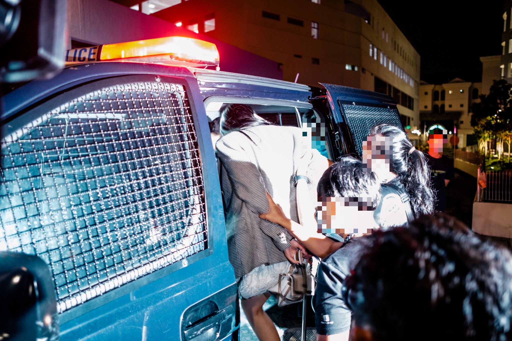 Image of a woman being arrested