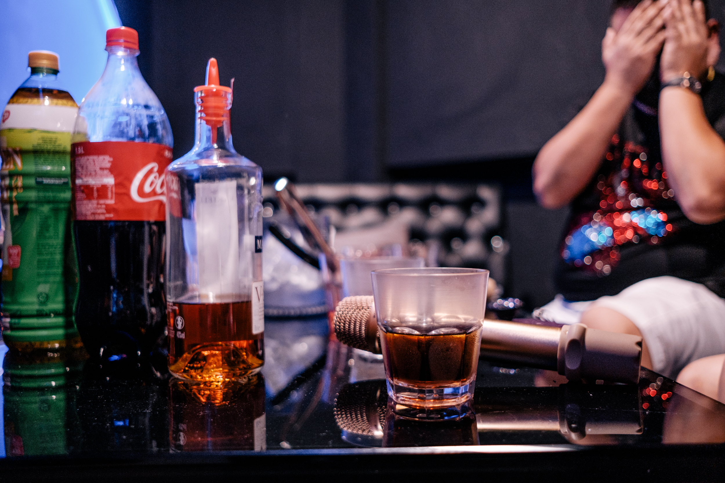 Image of the liquour and microphone on the table in the illegal KTV