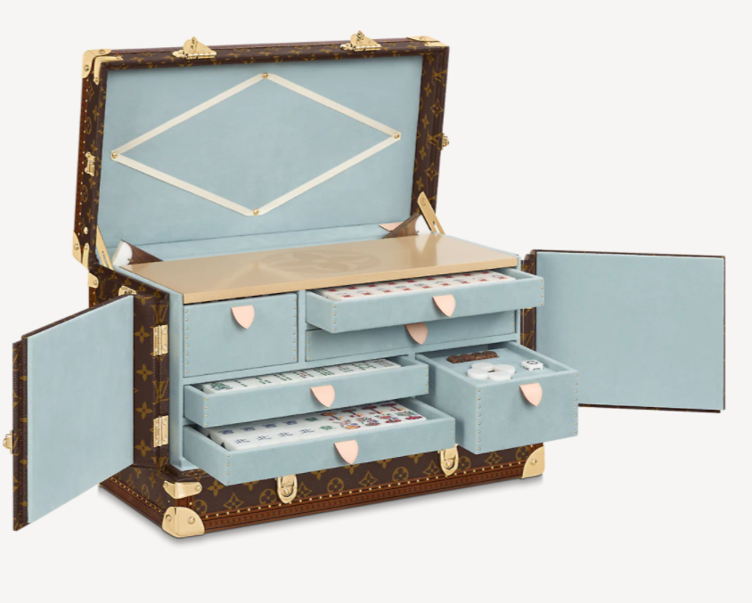 Hand-carved wood & stone mahjong set by Louis Vuitton selling for