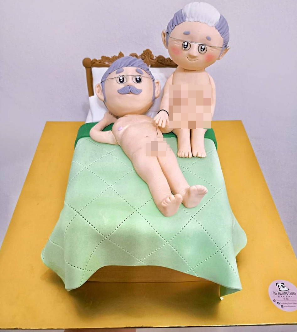 A NSFW cake of a nude elderly couple