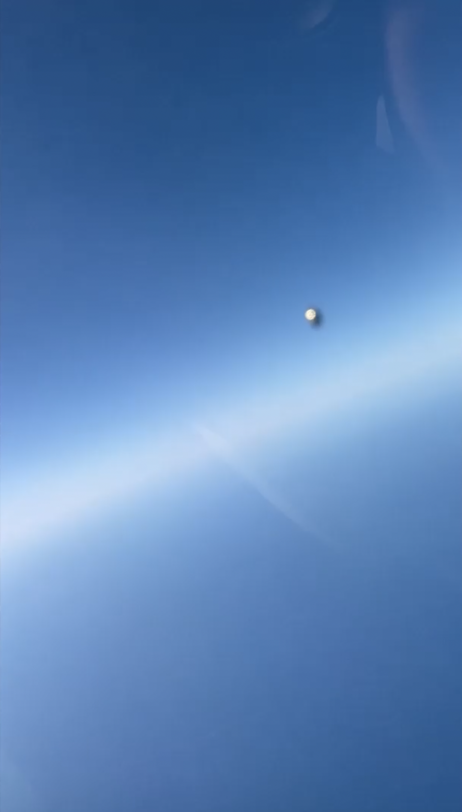 A spherical UFO zoomed past a fighter jet