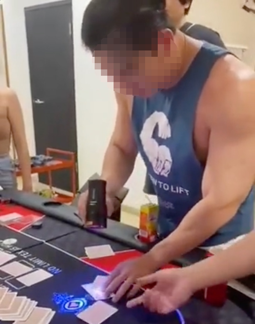 In the video, the muscle-bound host, dressed in a blue tank top, can be seen shining a UV flashlight over the cards and admitting in a somewhat astonished fashion that the cards were marked.