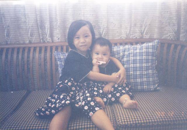 Ho with her younger sister, circa 98. Image courtesy of Emily Ho.