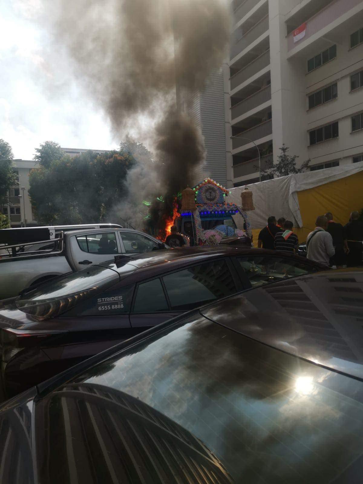 Funeral hearse at Woodlands carpark catches fire on National Day afternoon - Mothership.SG (Picture 1)
