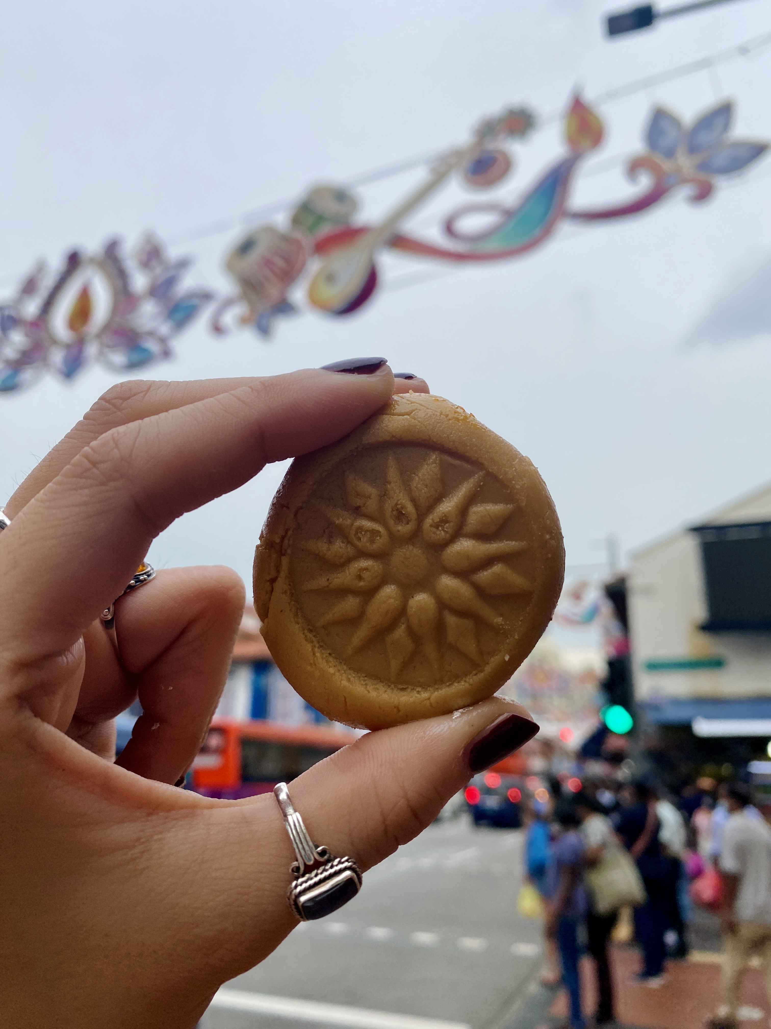 image of coin shaped snack against a street backdrop