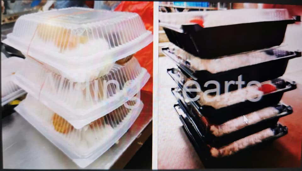image of stacked disposable containers of food