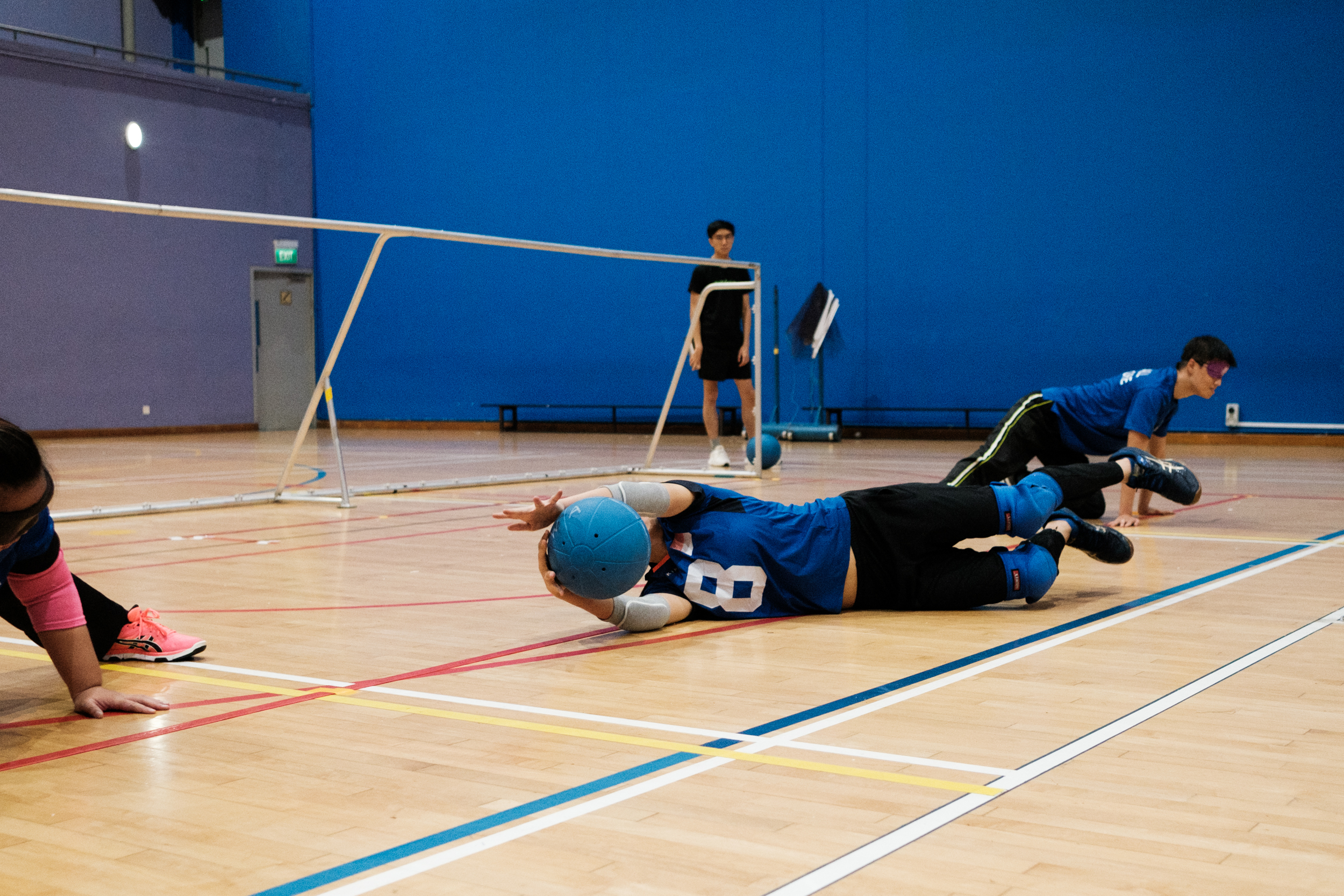 Joan Hung blocks a ball from rolling into her goal