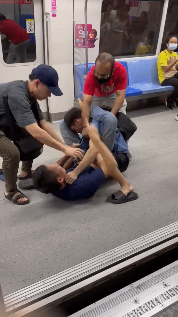 Two men fighting while two others try to break up the fight