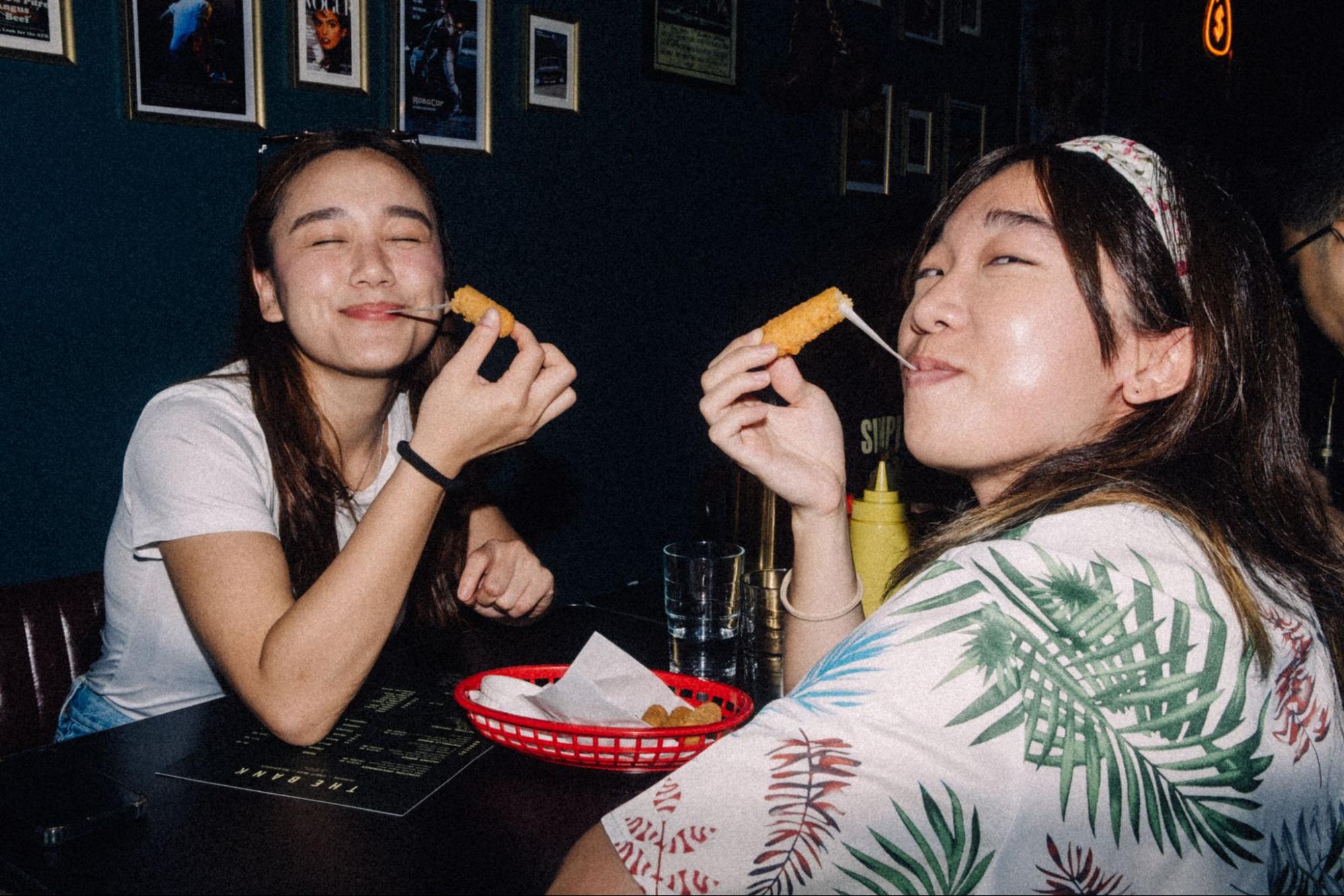 Alfie and Jinghui with their cheese sticks