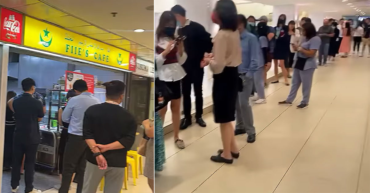 A long queue for a Nasi Goreng shop inside a mall.