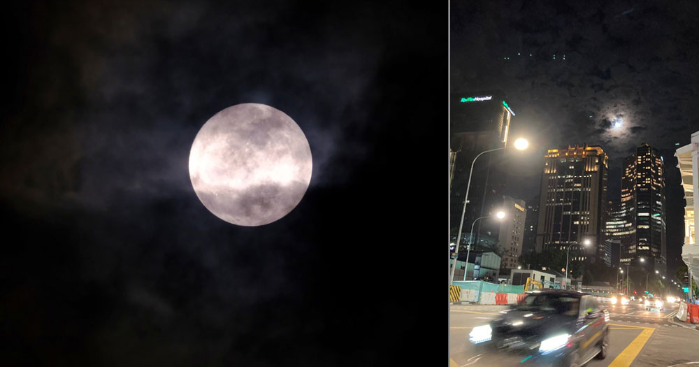 Supermoon shines in S'pore sky through clouds trying to steal its