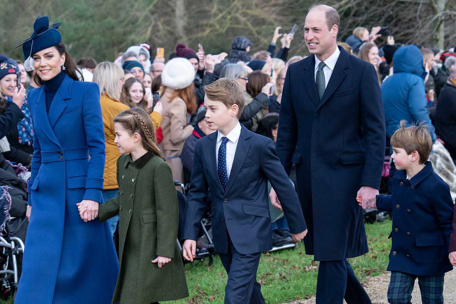 The royal family walking hand-in-hand 