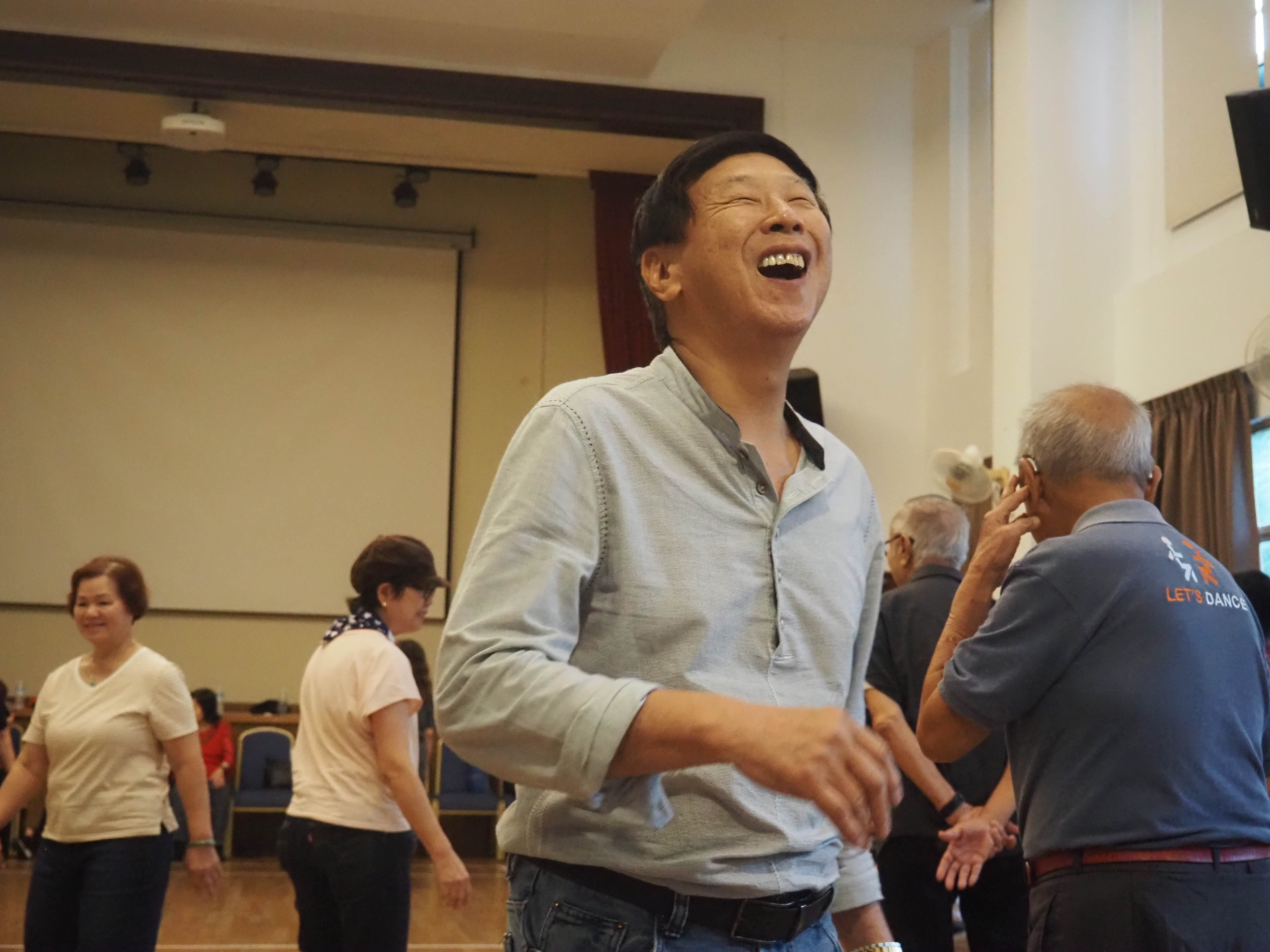 Michael Pang laughing at the dance jam.