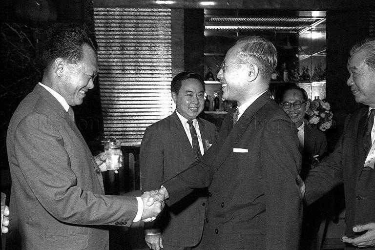 PM Lee (L) shaking hands with Tan Siew Sin