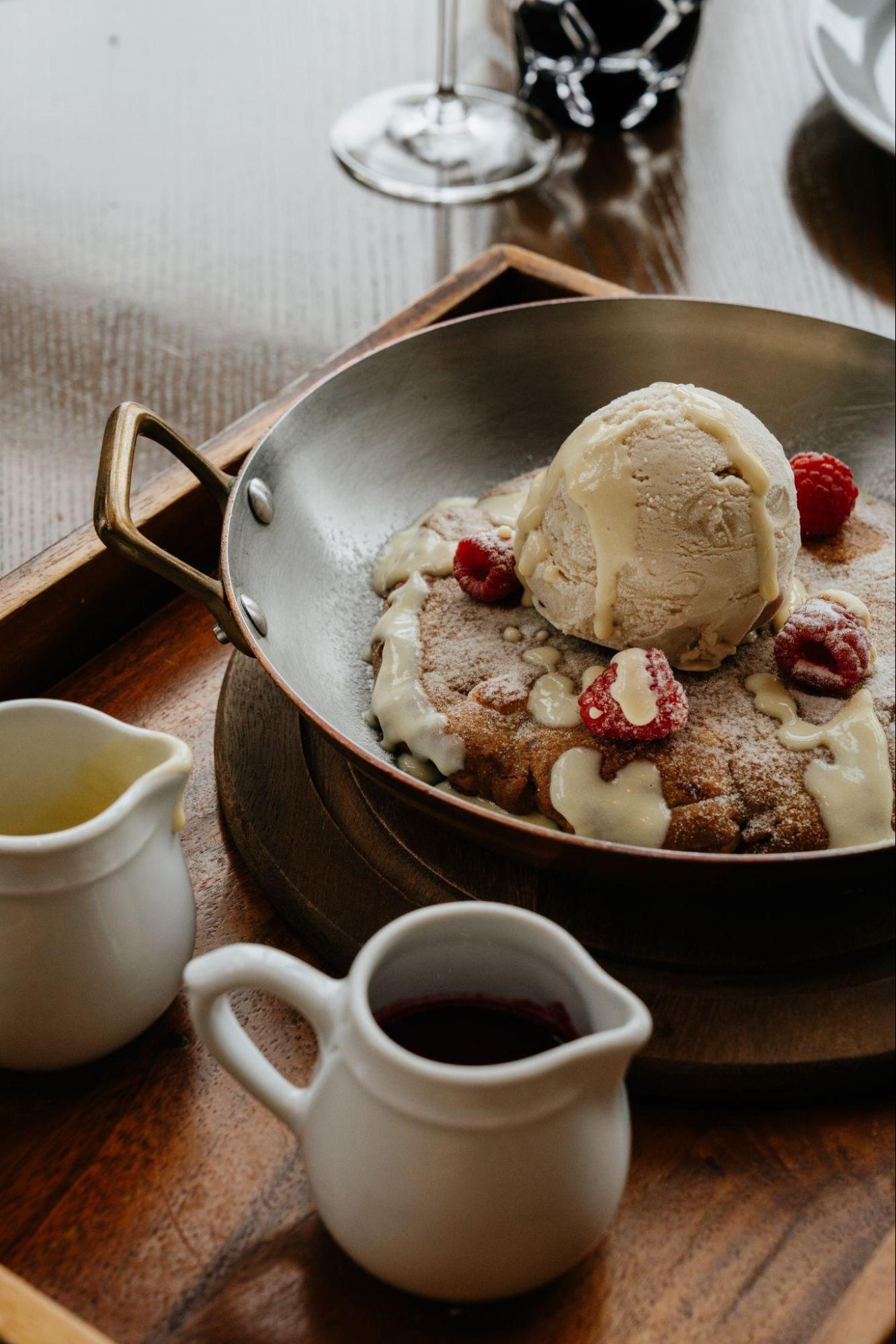 Soft-baked raspberry macadamia and white chocolate cookie with burnt toast ice cream.