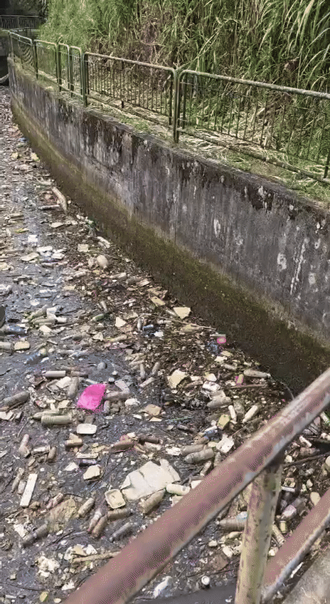 rail corridor trash filled drain
